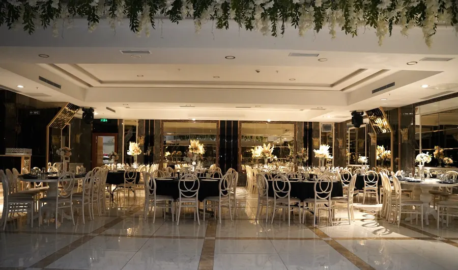 Tables under a greenery ceiling