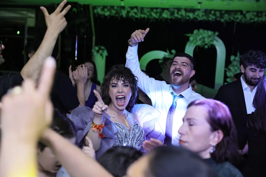 Bride and guests dancing